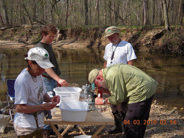 4 - Gretchen Schwartz  Phillip Capon_ Charlie Dorian_ and Jewl Barlow identify the first sample collected at the site_ April 2010